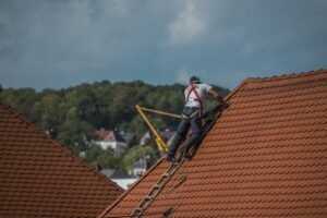 A person is repairing the roof with AcrylDach