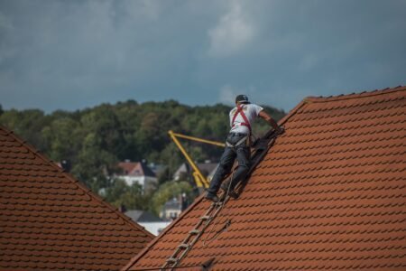 A person is repairing the roof with AcrylDach