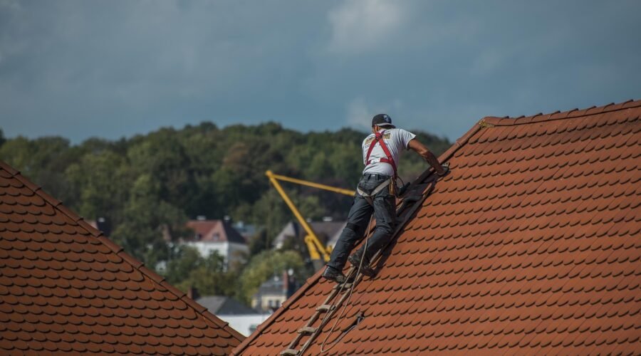 A person is repairing the roof with AcrylDach