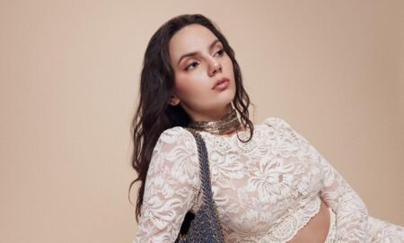 Dafne Keen in white dress