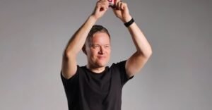 Mark Goldbridge holding something